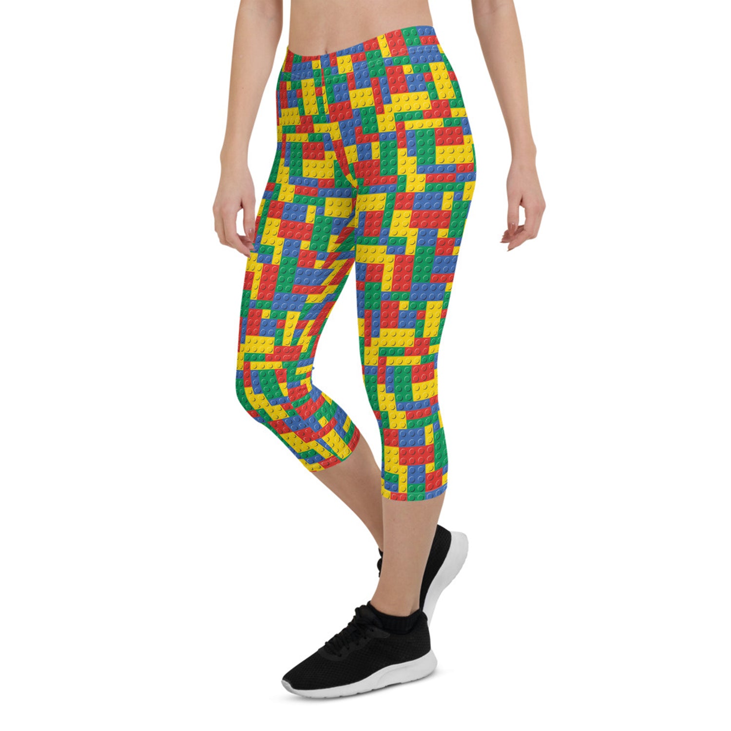 A pair of Women's Colorful Building Blocks Capri Leggings featuring vibrant, unique graphic designs, perfect for workouts and casual wear.