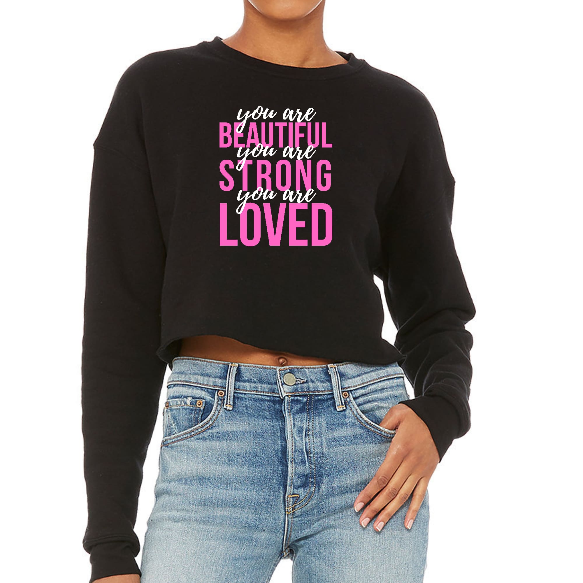 A stylish women's cropped graphic sweatshirt in pink and white, featuring the inspirational text 'You Are Beautiful Strong Loved' on the front.