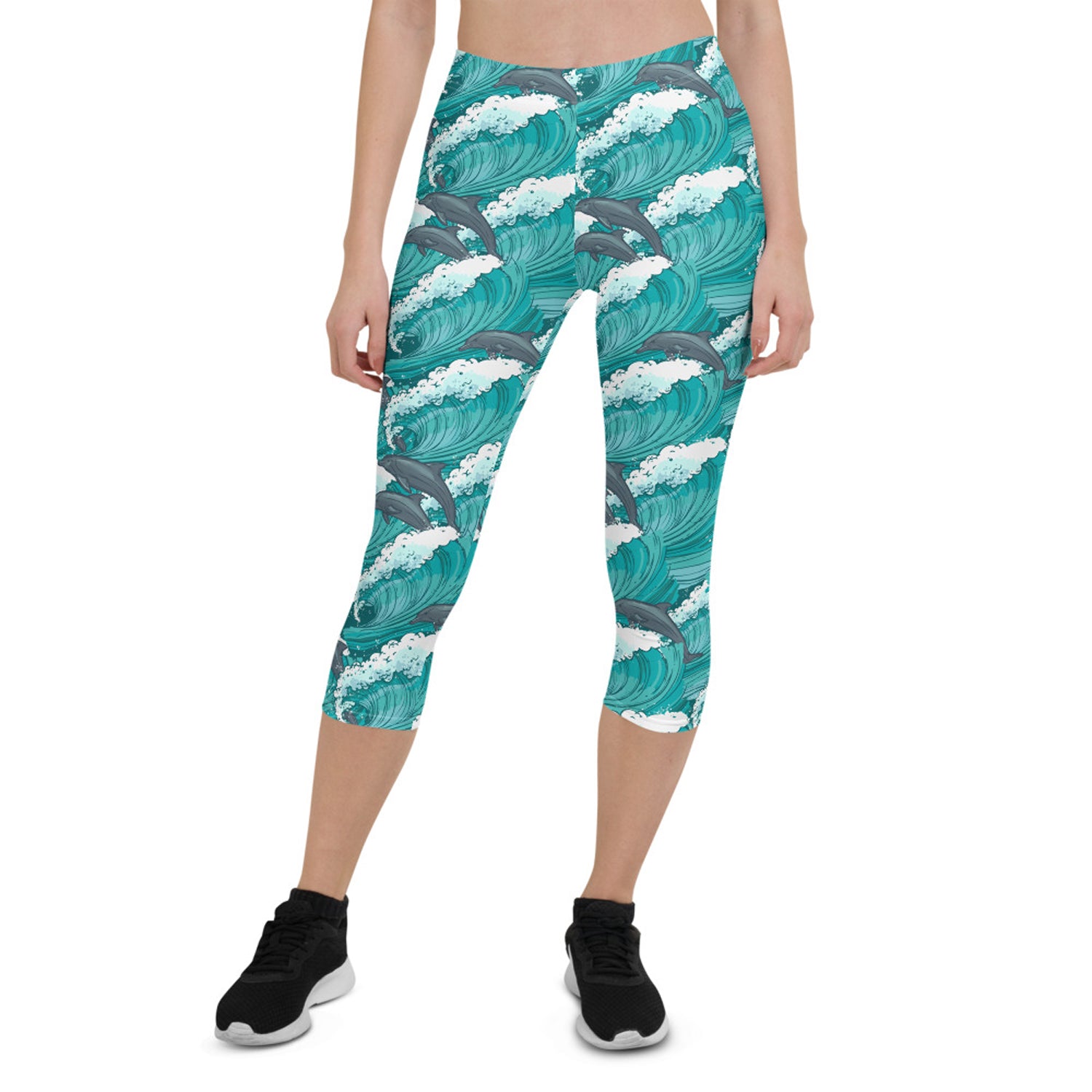 Women's Dolphin and Waves Capri Leggings featuring vibrant dolphin and wave designs, perfect for workouts and casual wear.