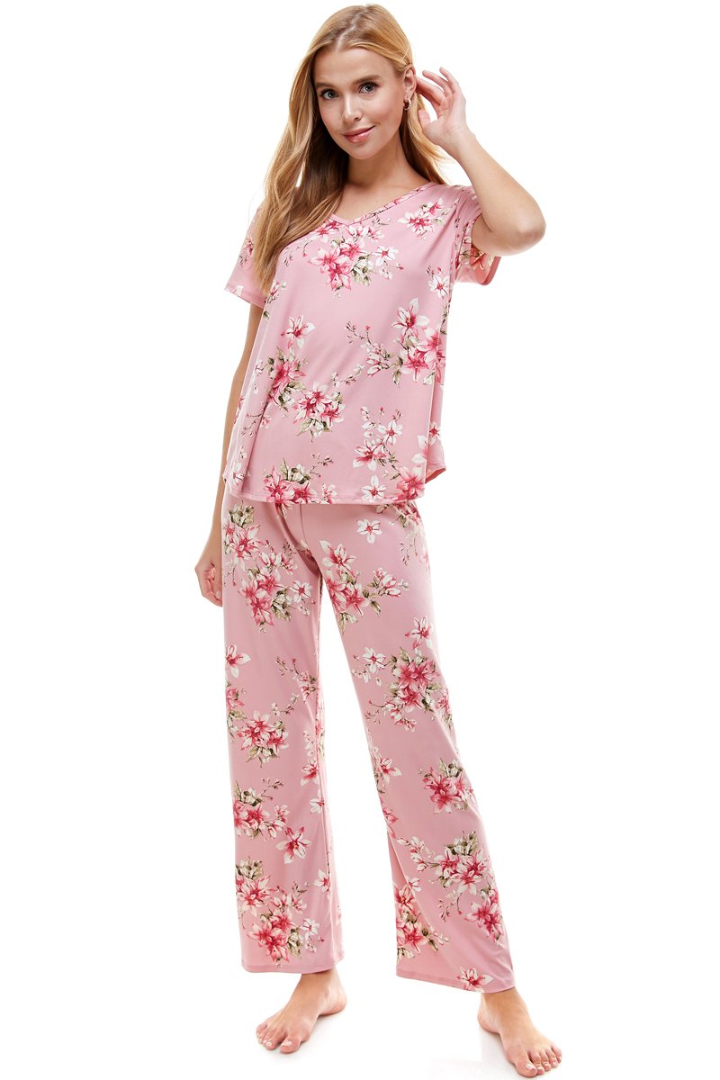 Women's floral print pajama set featuring a short sleeve top and matching pants in blush and ivory colors, designed for comfort and style.