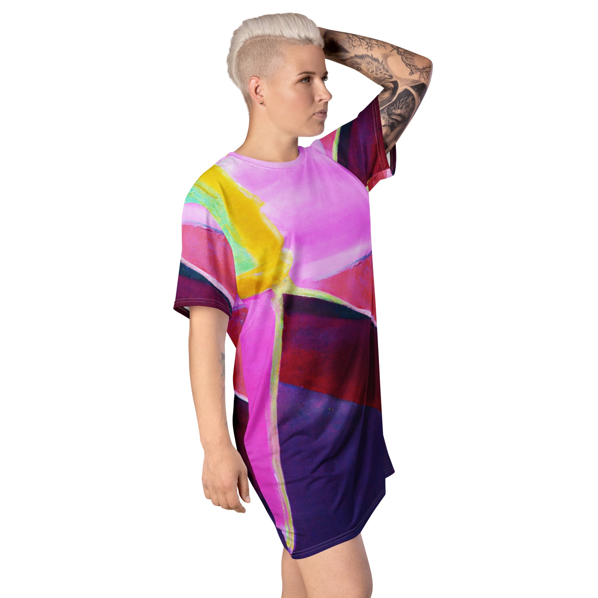 Womens Graphic T-shirt Dress featuring a vibrant pink and purple pattern, showcasing its oversized fit and stylish design.