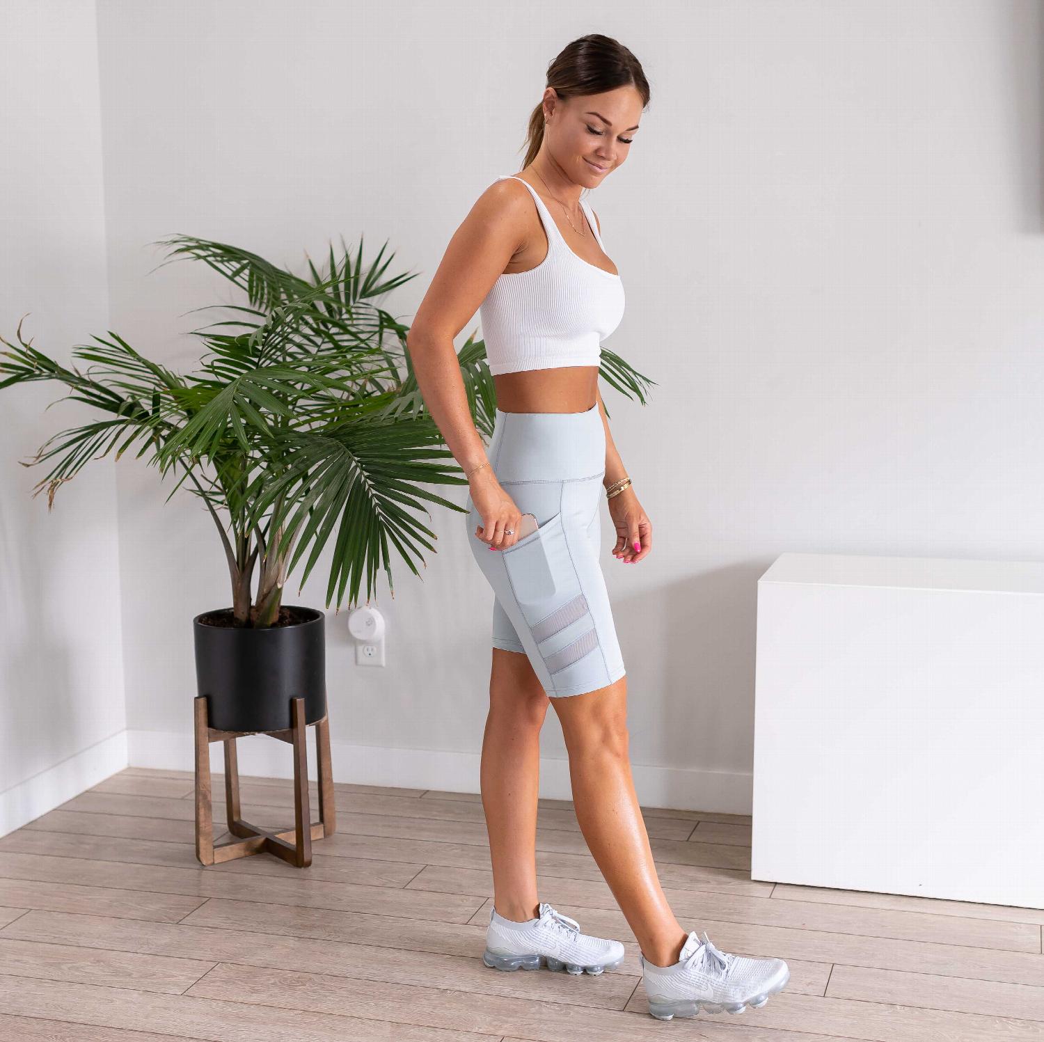 Womens High Waist Tummy Control Mesh Biker Shorts featuring a high waistband, mesh cutouts, and pockets, ideal for workouts.