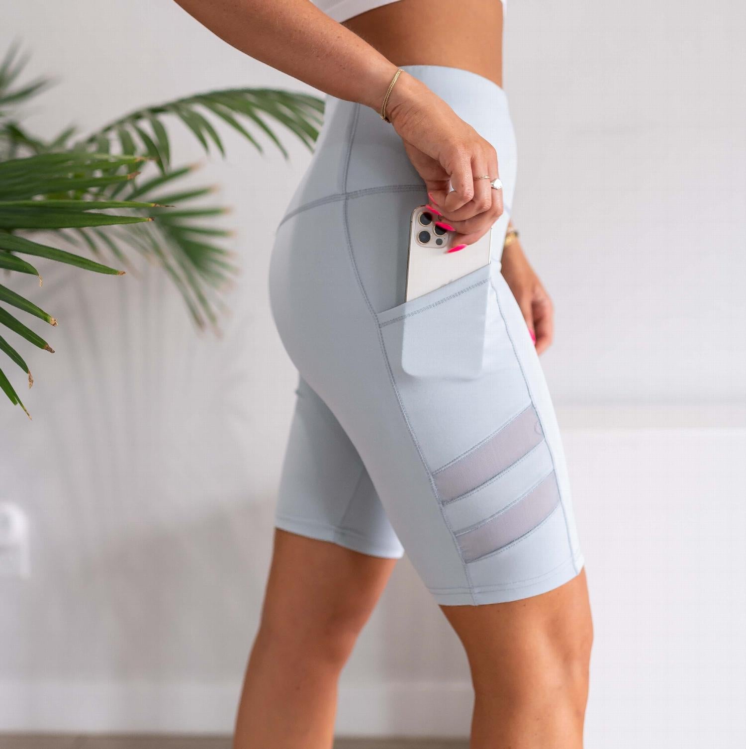 Womens High Waist Tummy Control Mesh Biker Shorts featuring a high waistband, mesh cutouts, and pockets, ideal for workouts.