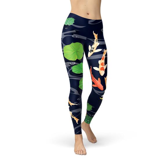 A pair of women's leggings featuring a vibrant koi fish design set against a serene pond background, showcasing their unique and colorful print.