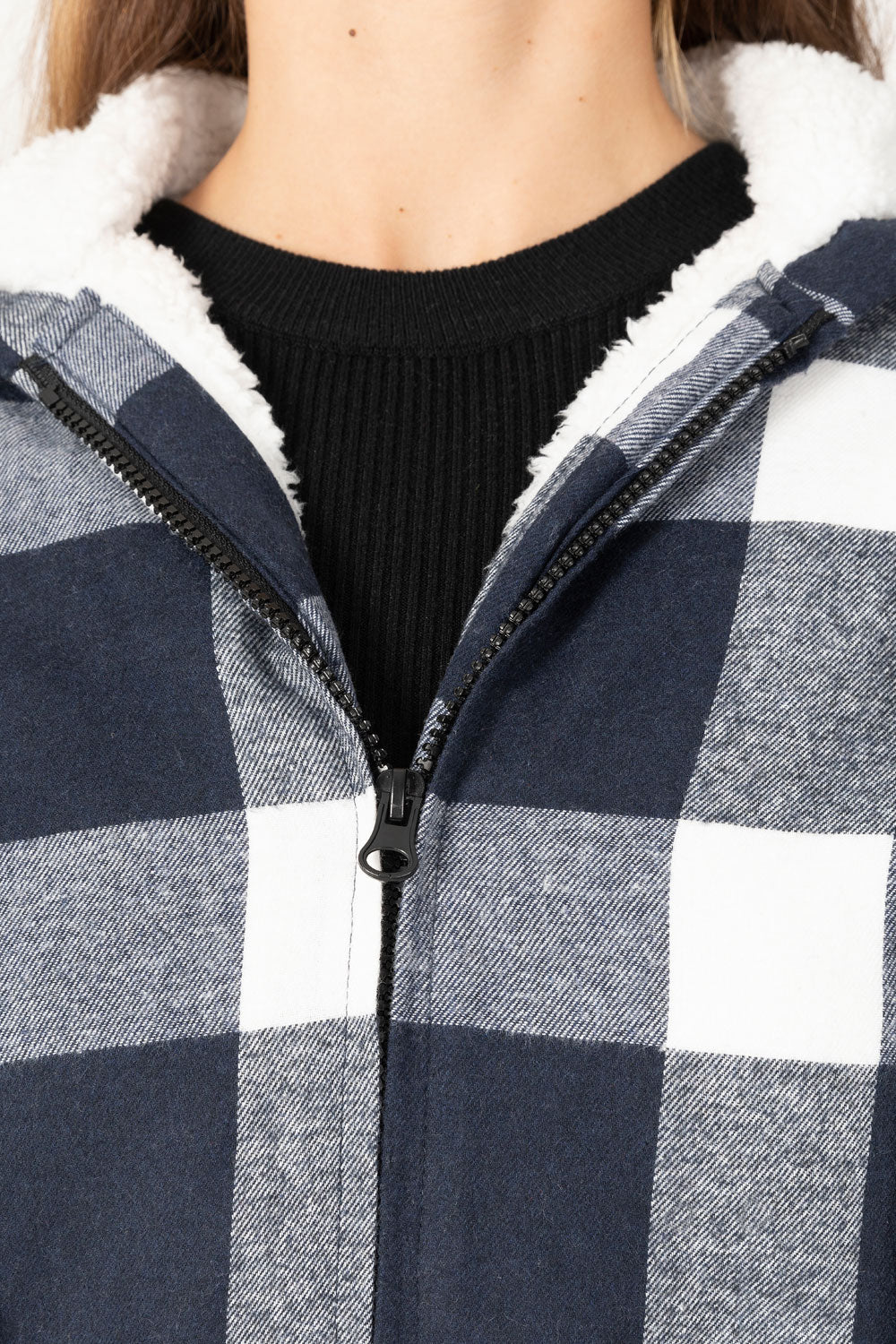 Women's sherpa-lined flannel jacket with a full zip-up design, featuring a hood and plaid pattern, perfect for chilly weather.