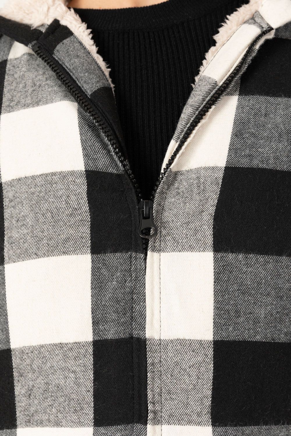 Women's sherpa-lined flannel jacket with a full zip-up design, featuring a hood and plaid pattern, perfect for chilly weather.