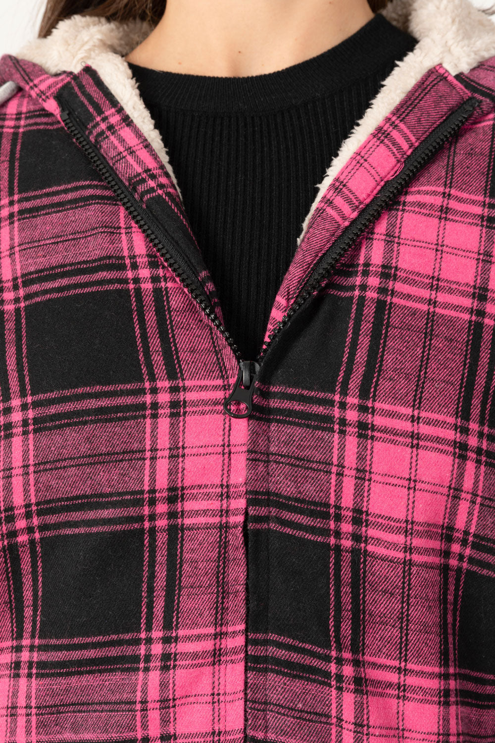 Women's sherpa-lined flannel jacket with a full zip-up design, featuring a hood and plaid pattern, perfect for chilly weather.