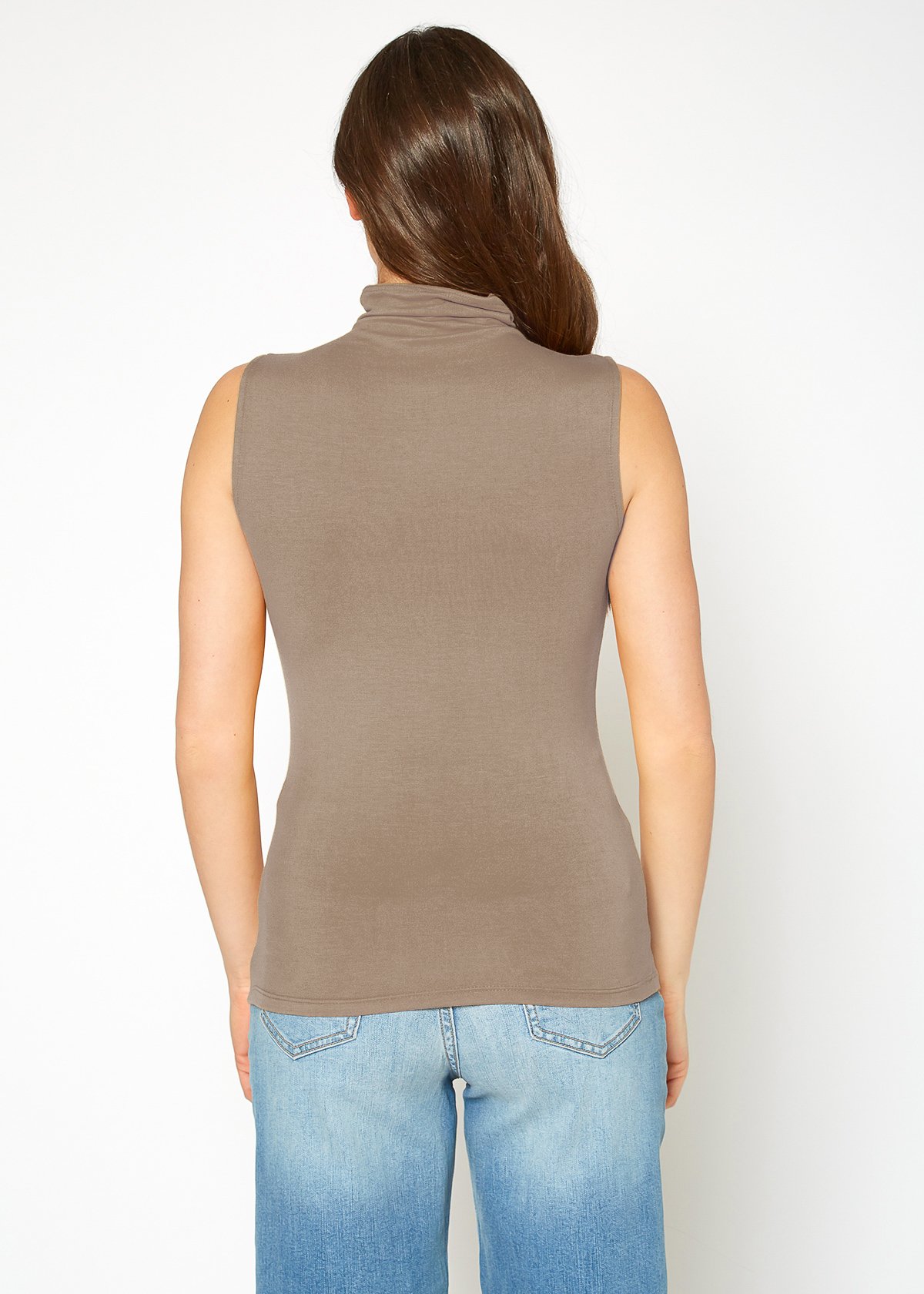 A stylish Women's Sleeveless Turtle Neck Fitted Top in a soft fabric, perfect for layering in fall and winter.