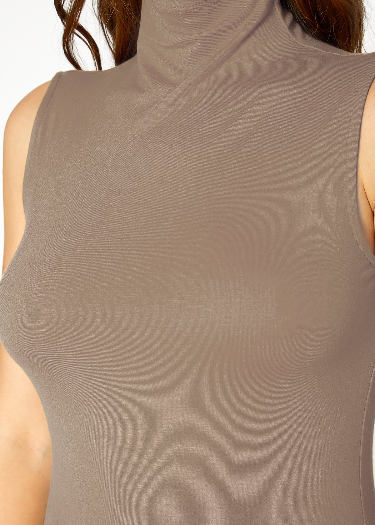 A stylish Women's Sleeveless Turtle Neck Fitted Top in a soft fabric, perfect for layering in fall and winter.