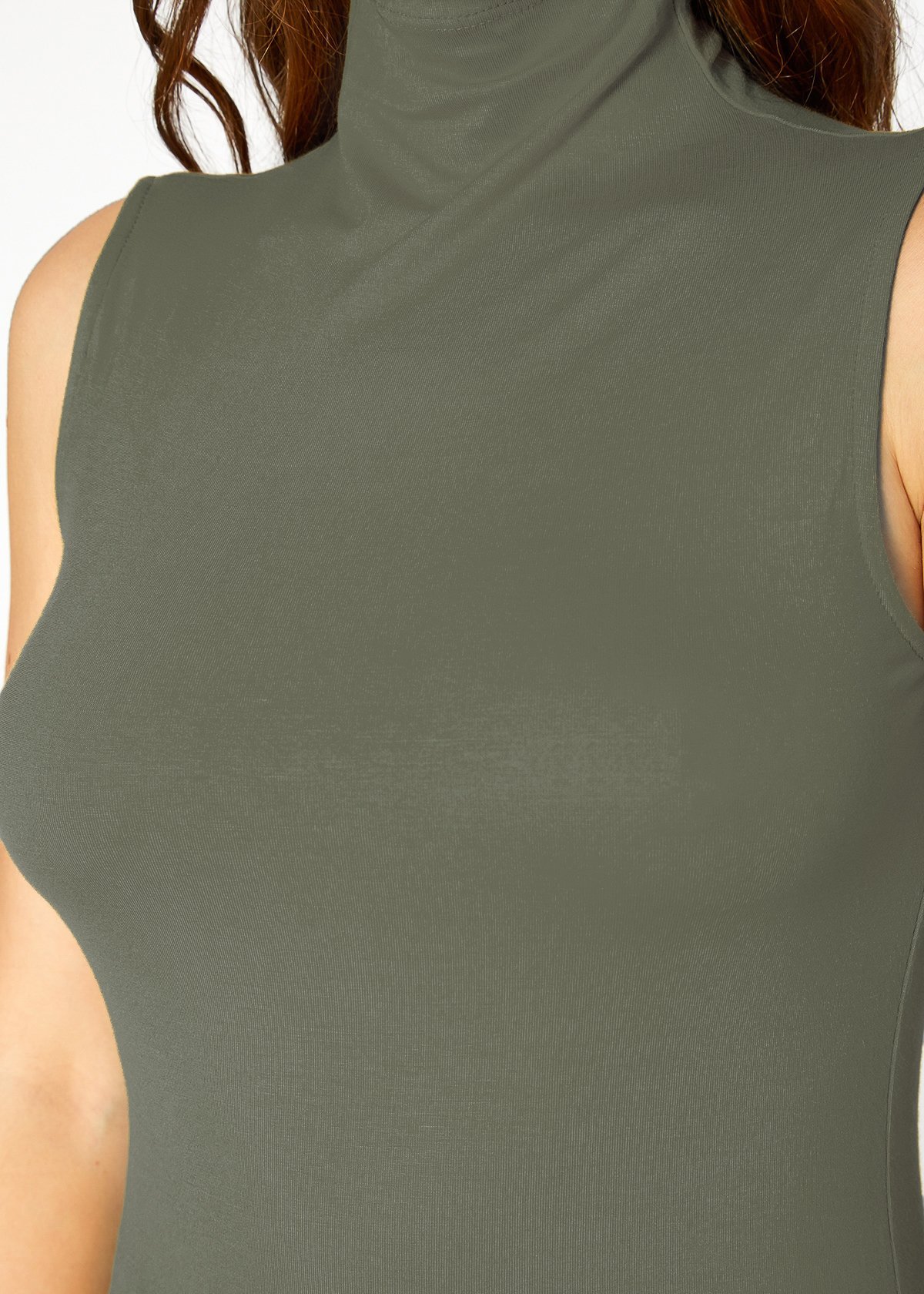 A stylish Women's Sleeveless Turtle Neck Fitted Top in a soft fabric, perfect for layering in fall and winter.