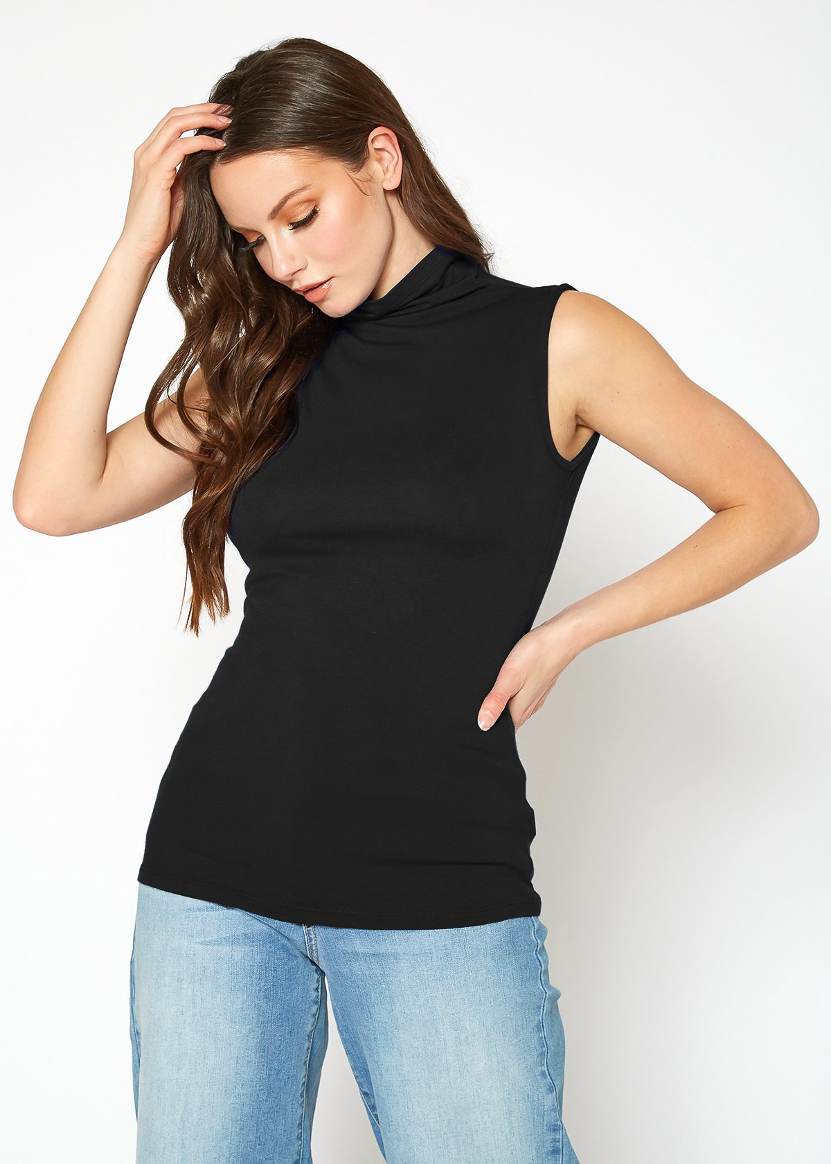 A stylish Women's Sleeveless Turtle Neck Fitted Top in a soft fabric, perfect for layering in fall and winter.