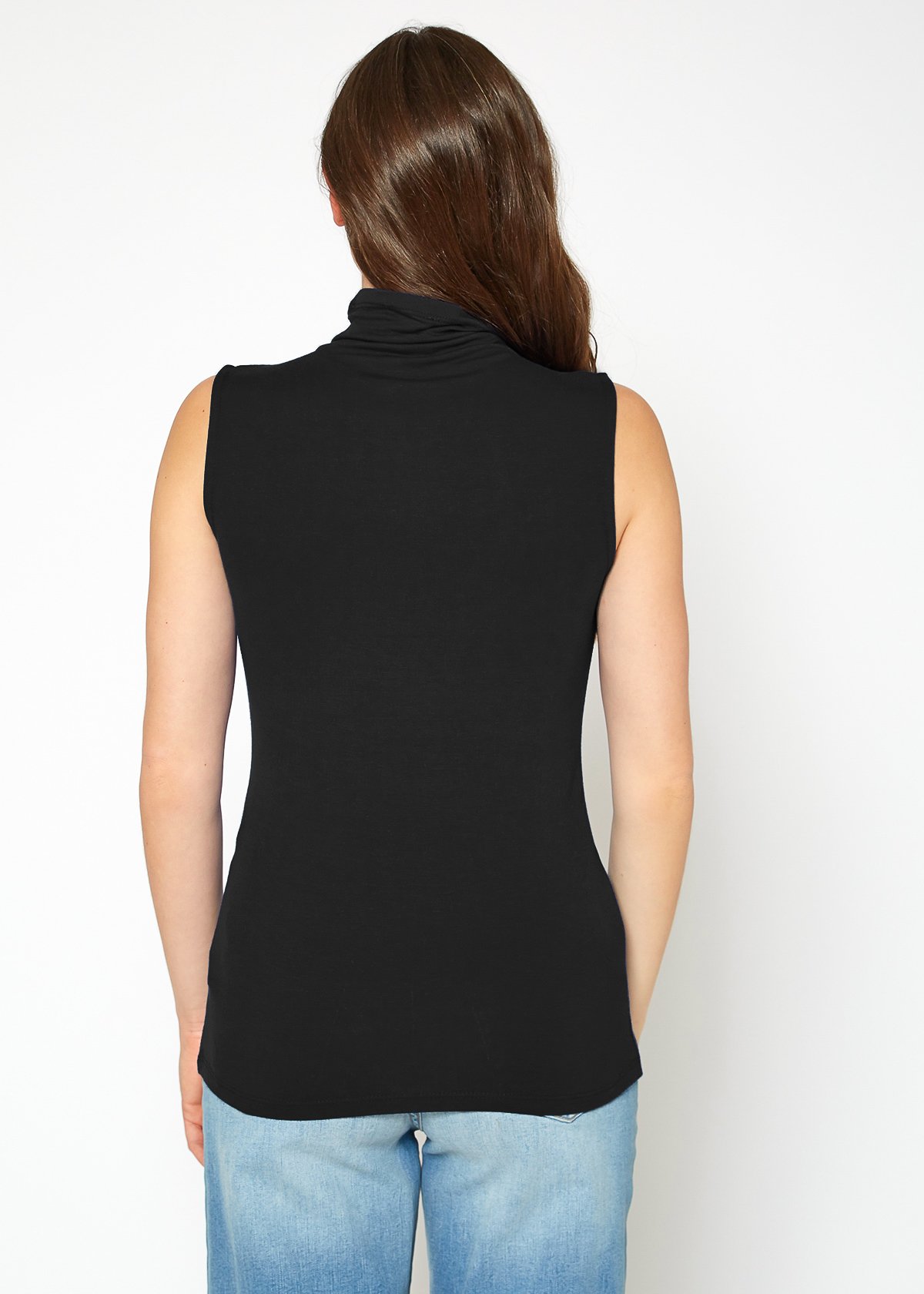 A stylish Women's Sleeveless Turtle Neck Fitted Top in a soft fabric, perfect for layering in fall and winter.