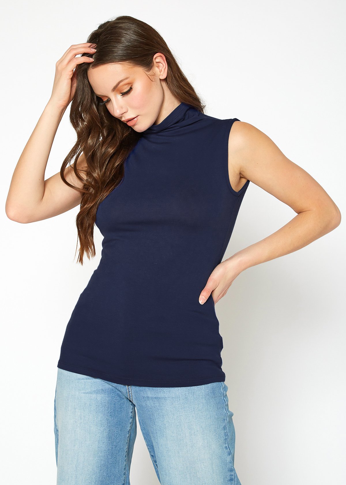 A stylish Women's Sleeveless Turtle Neck Fitted Top in a soft fabric, perfect for layering in fall and winter.