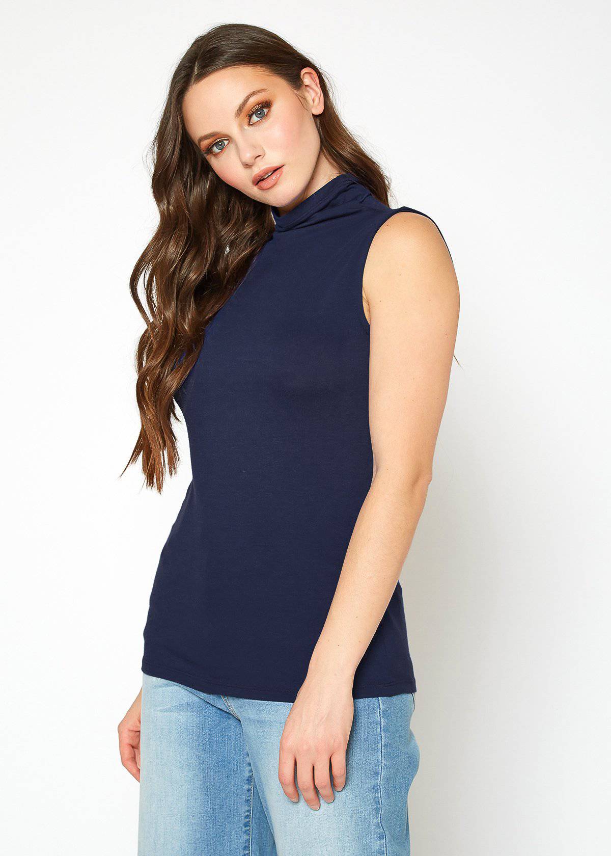A stylish Women's Sleeveless Turtle Neck Fitted Top in a soft fabric, perfect for layering in fall and winter.