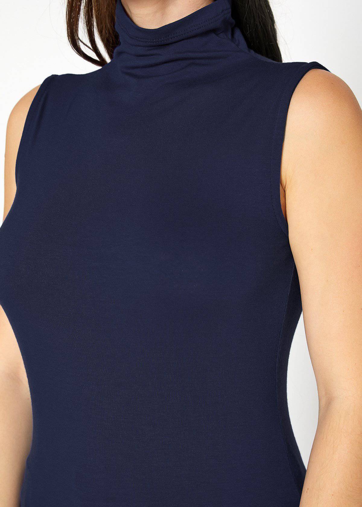 A stylish Women's Sleeveless Turtle Neck Fitted Top in a soft fabric, perfect for layering in fall and winter.