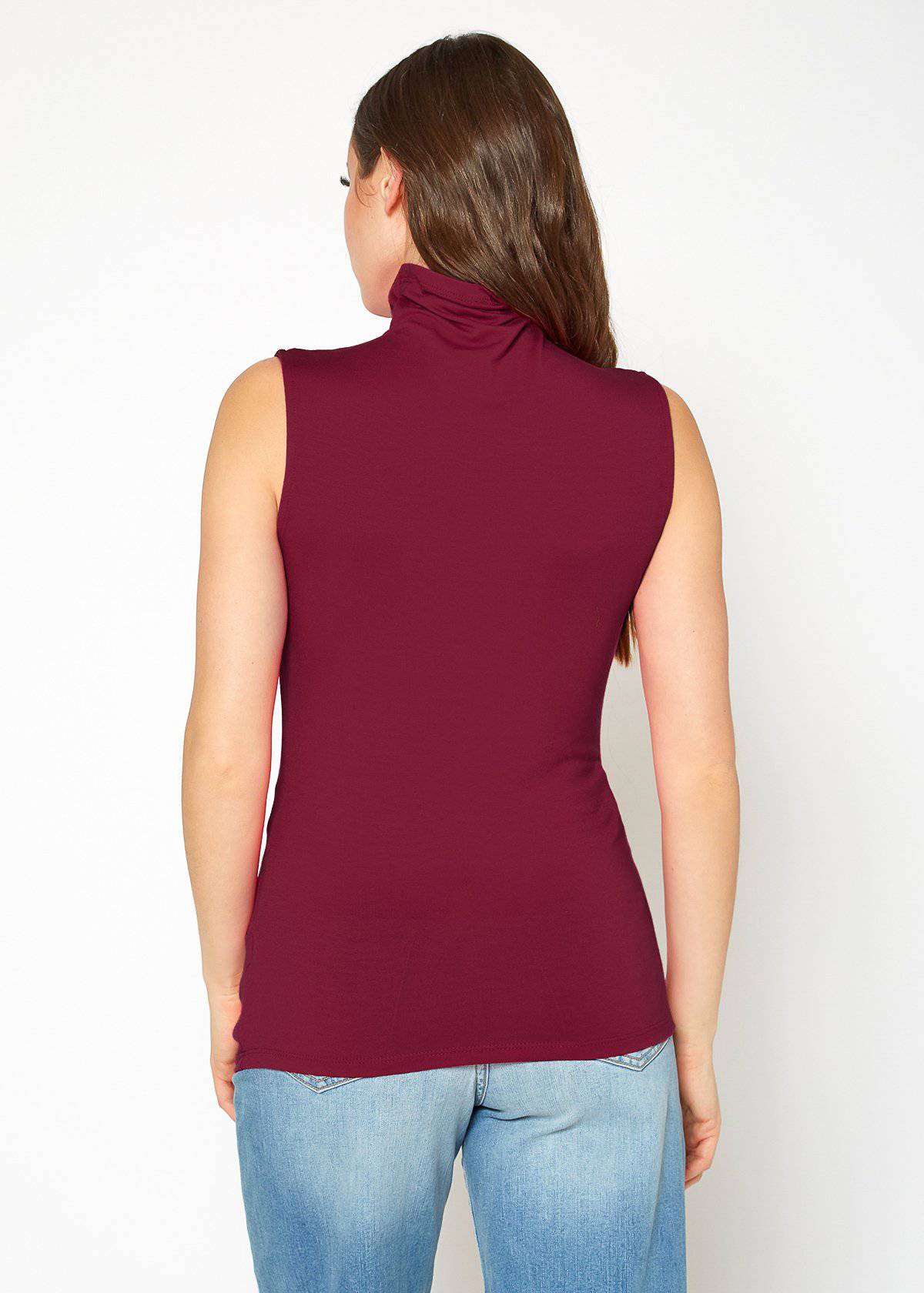 A stylish Women's Sleeveless Turtle Neck Fitted Top in a soft fabric, perfect for layering in fall and winter.