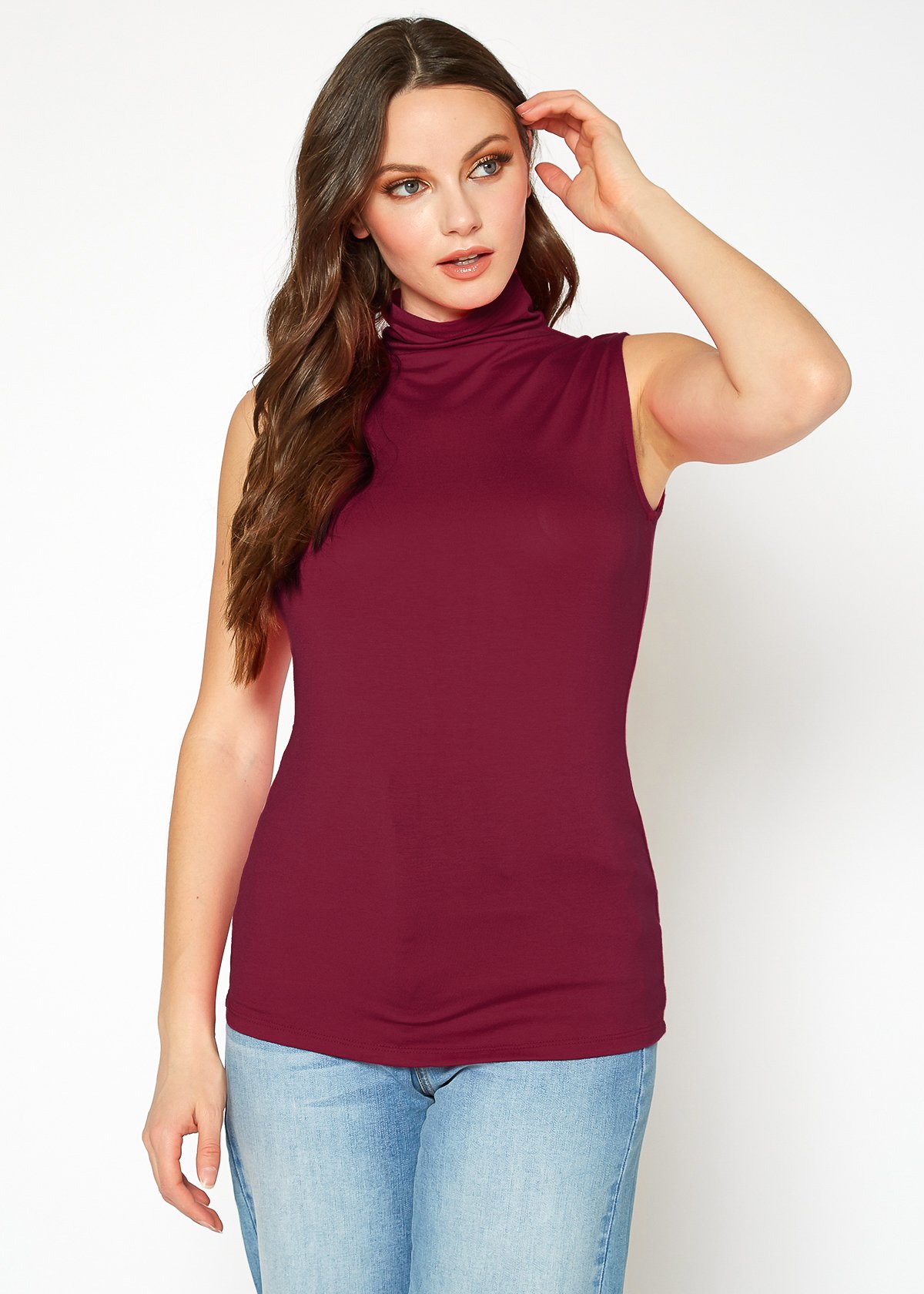 A stylish Women's Sleeveless Turtle Neck Fitted Top in a soft fabric, perfect for layering in fall and winter.