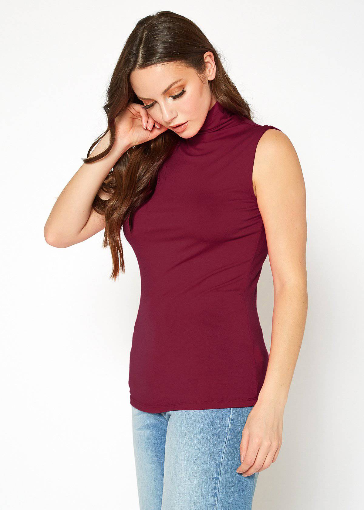 A stylish Women's Sleeveless Turtle Neck Fitted Top in a soft fabric, perfect for layering in fall and winter.