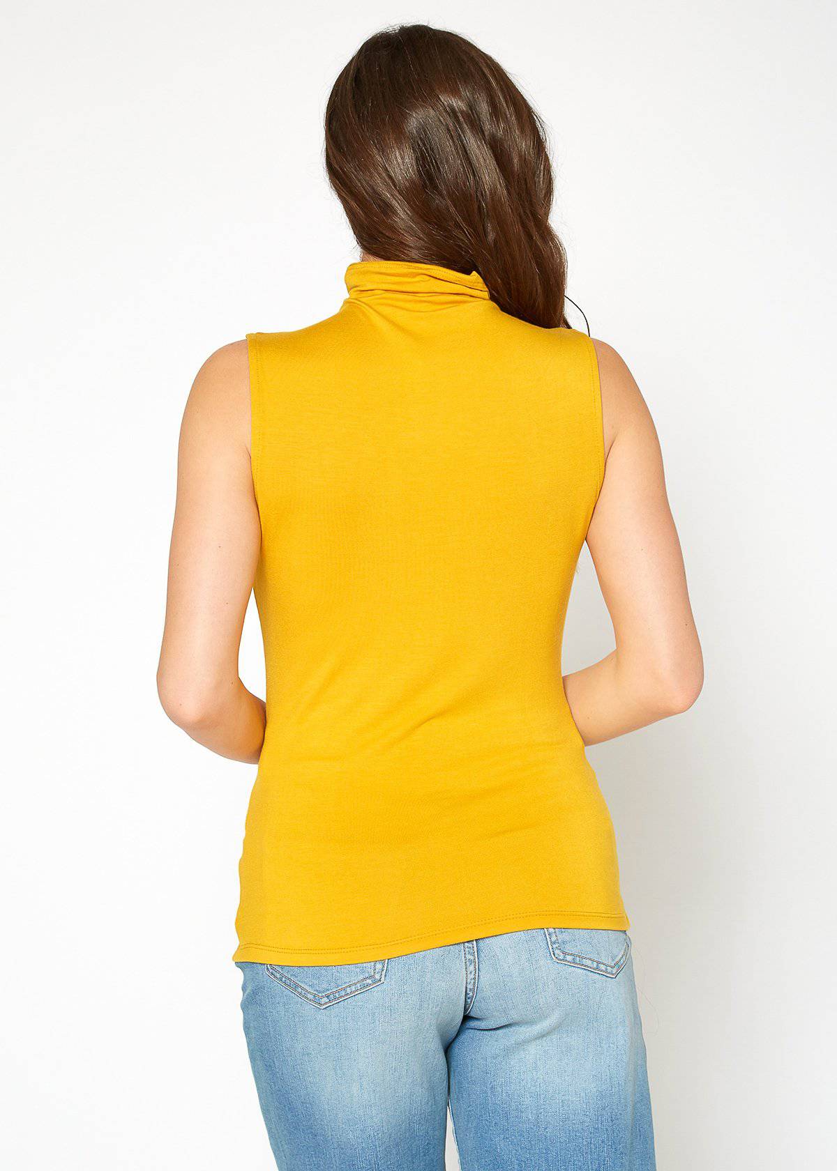 A stylish Women's Sleeveless Turtle Neck Fitted Top in a soft fabric, perfect for layering in fall and winter.