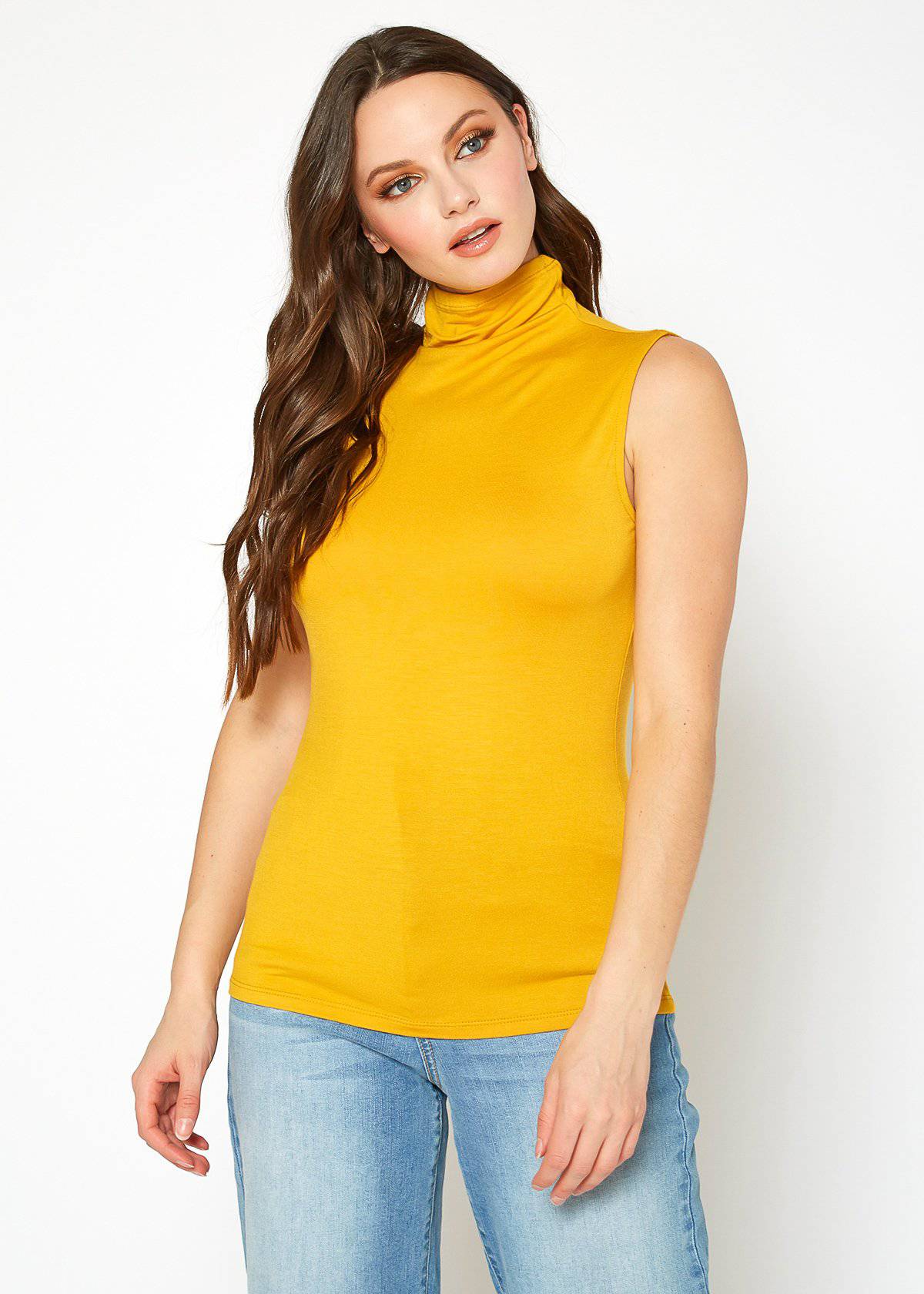 A stylish Women's Sleeveless Turtle Neck Fitted Top in a soft fabric, perfect for layering in fall and winter.