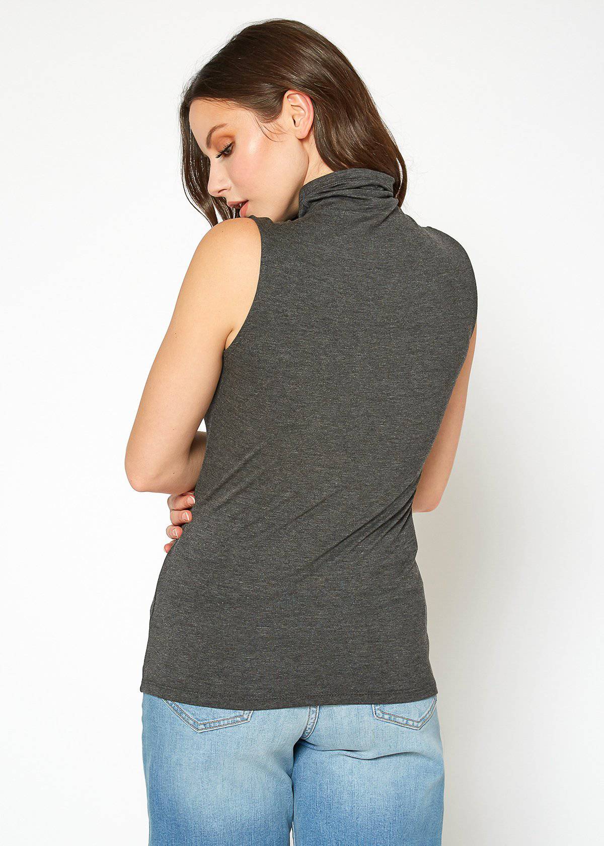 A stylish Women's Sleeveless Turtle Neck Fitted Top in a soft fabric, perfect for layering in fall and winter.