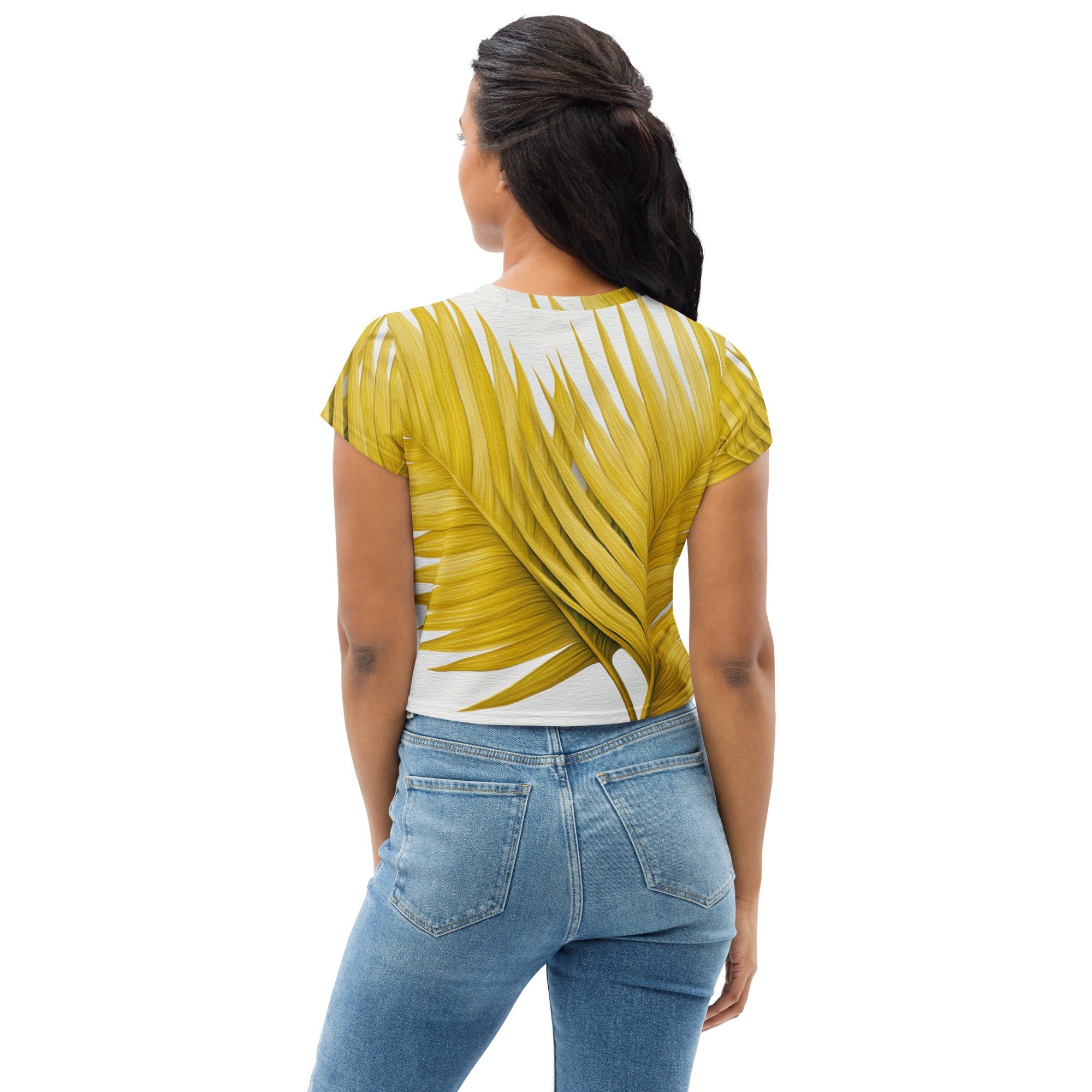A vibrant yellow crop tee featuring palm leaves design, perfect for casual wear.