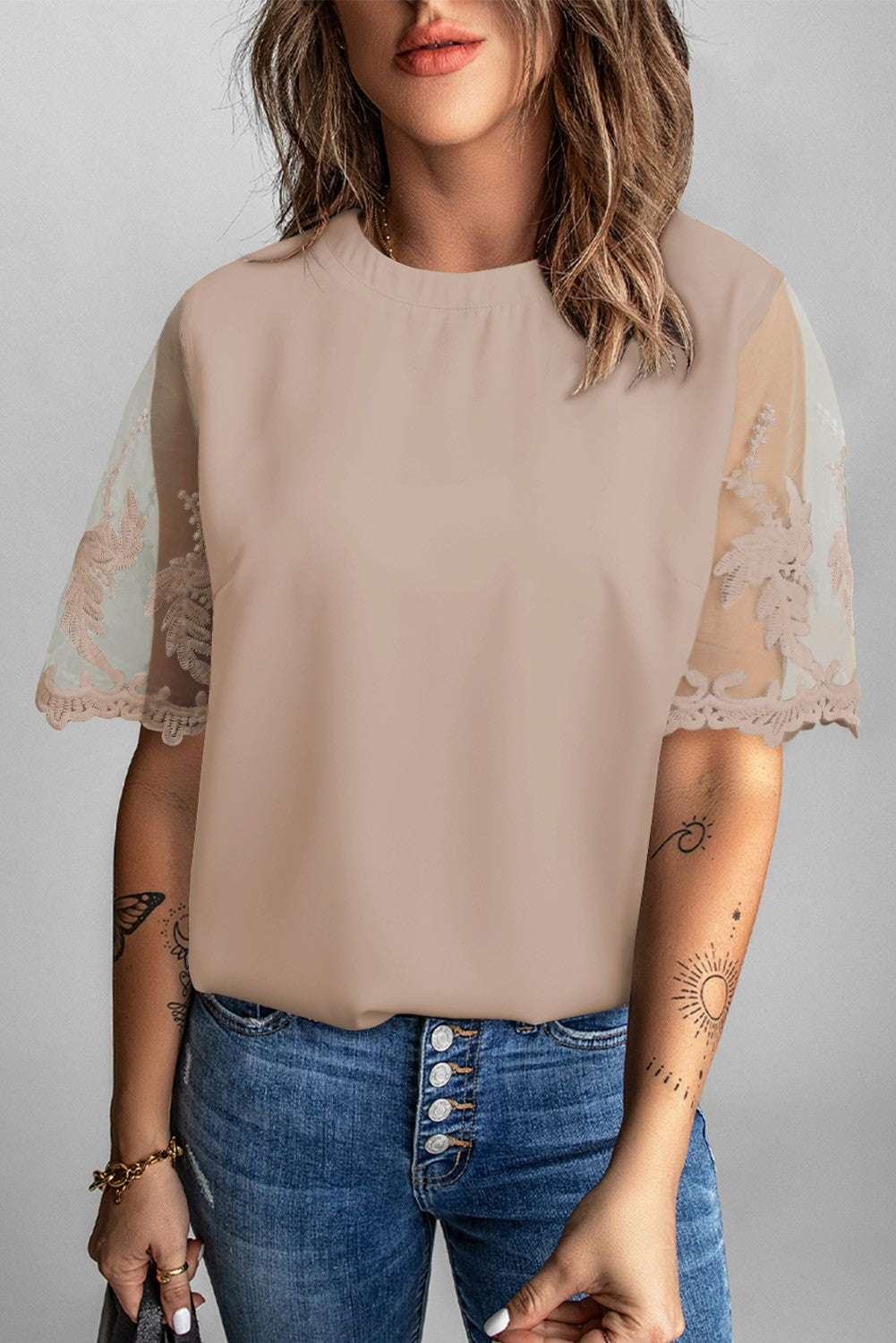 Women's apricot T-shirt with transparent lace sleeves, featuring a round collar and loose fit, perfect for casual and elegant wear.