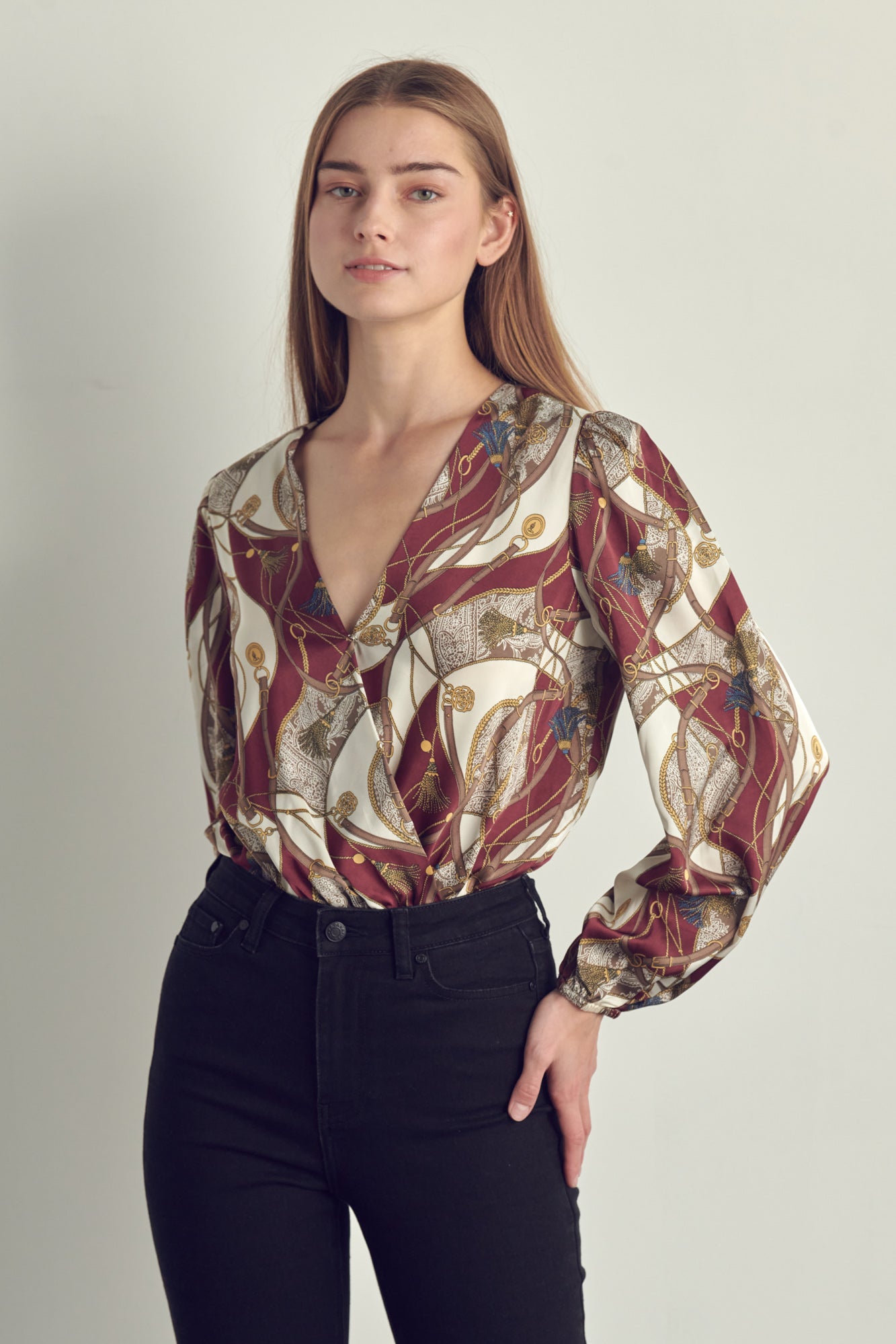 Women's V-Neck Abstract Print Blouse featuring long sleeves and a stylish surplice neckline in burgundy chain and black abstract prints.