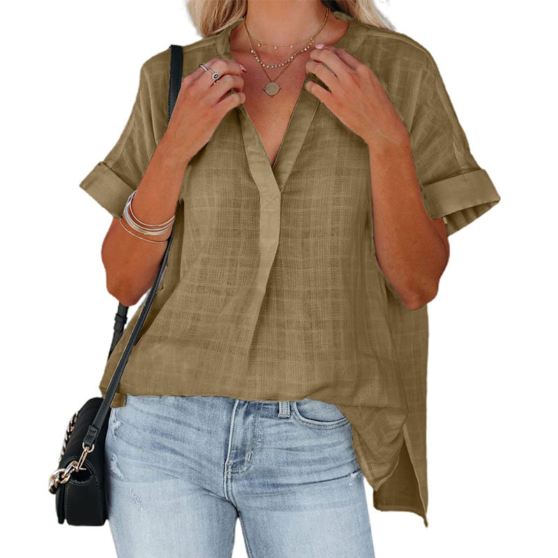 A stylish Women's V-Neck Short Sleeve Solid Color Thin Loose Check Shirt displayed on a mannequin, showcasing its elegant design and comfortable fit.