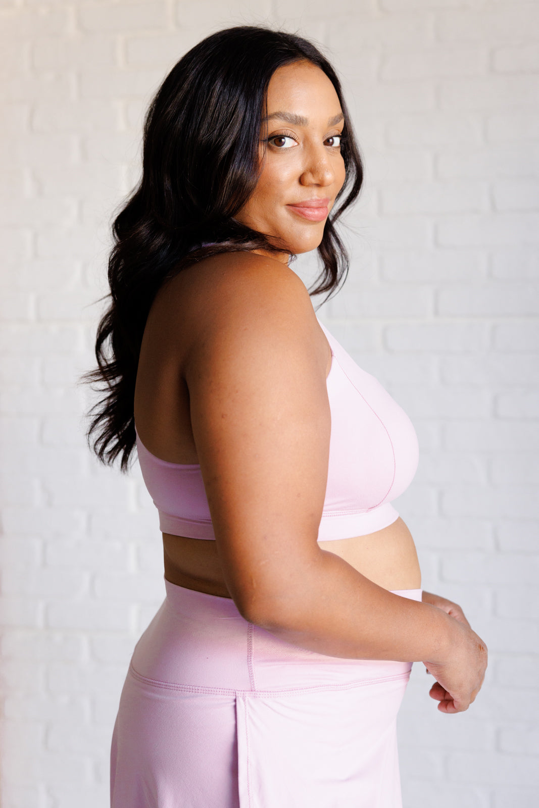 Mauve Peony Cross Back Sports Bra featuring a square neckline and back cutout, made from brushed microfiber with removable cups.