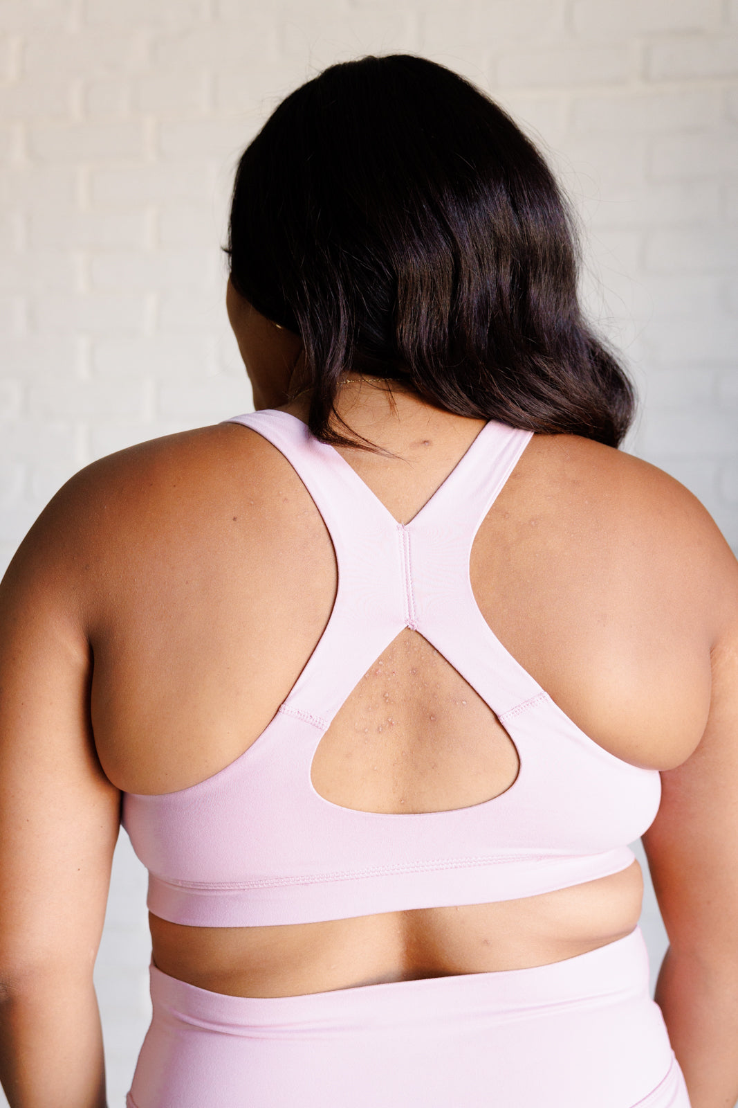 Mauve Peony Cross Back Sports Bra featuring a square neckline and back cutout, made from brushed microfiber with removable cups.