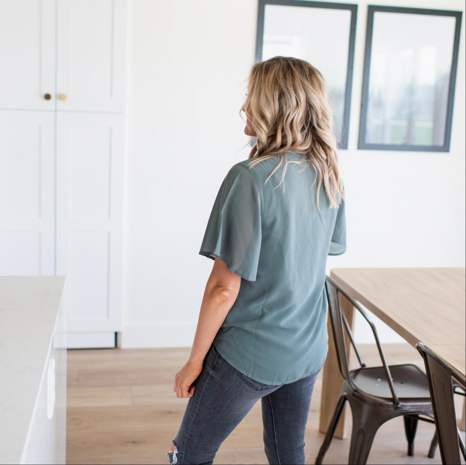 Woven Double Layer Chiffon Side Tie Top featuring a relaxed fit, v-neck, and ruffled long sleeves, perfect for spring and summer wear.