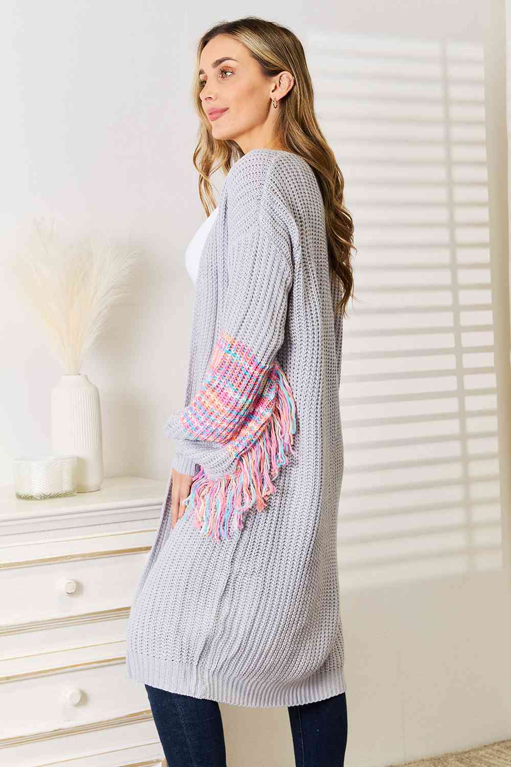 Woven Right Fringe Sleeve Dropped Shoulder Cardigan featuring trendy fringe details and a relaxed fit, perfect for stylish layering.