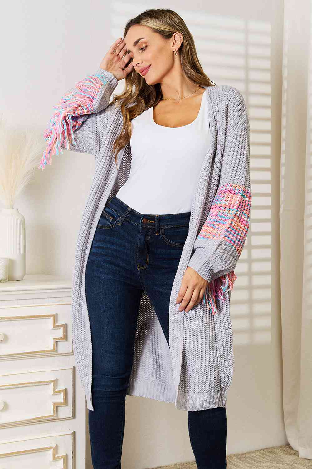 Woven Right Fringe Sleeve Dropped Shoulder Cardigan featuring trendy fringe details and a relaxed fit, perfect for stylish layering.
