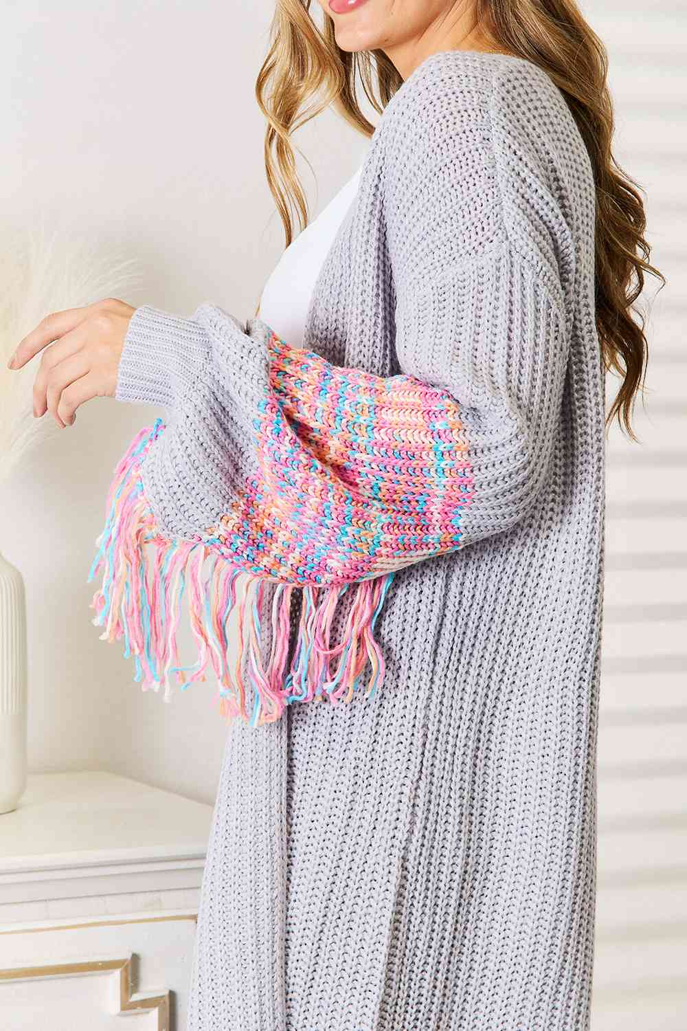 Woven Right Fringe Sleeve Dropped Shoulder Cardigan featuring trendy fringe details and a relaxed fit, perfect for stylish layering.