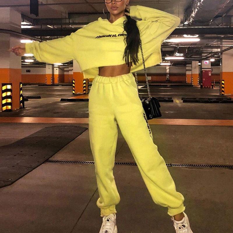 Yellow letter printing playsuit featuring long sleeves and a hood, designed for casual wear.