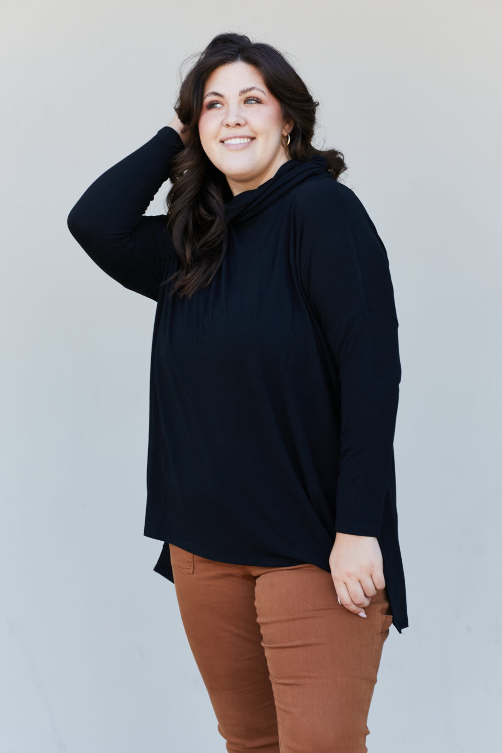 Zenana Full Size Slit High-Low Funnel Neck Top in Black, featuring a stylish slit design and cozy funnel neck, perfect for casual wear.