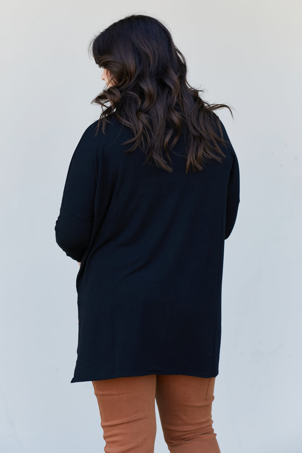 Zenana Full Size Slit High-Low Funnel Neck Top in Black, featuring a stylish slit design and cozy funnel neck, perfect for casual wear.