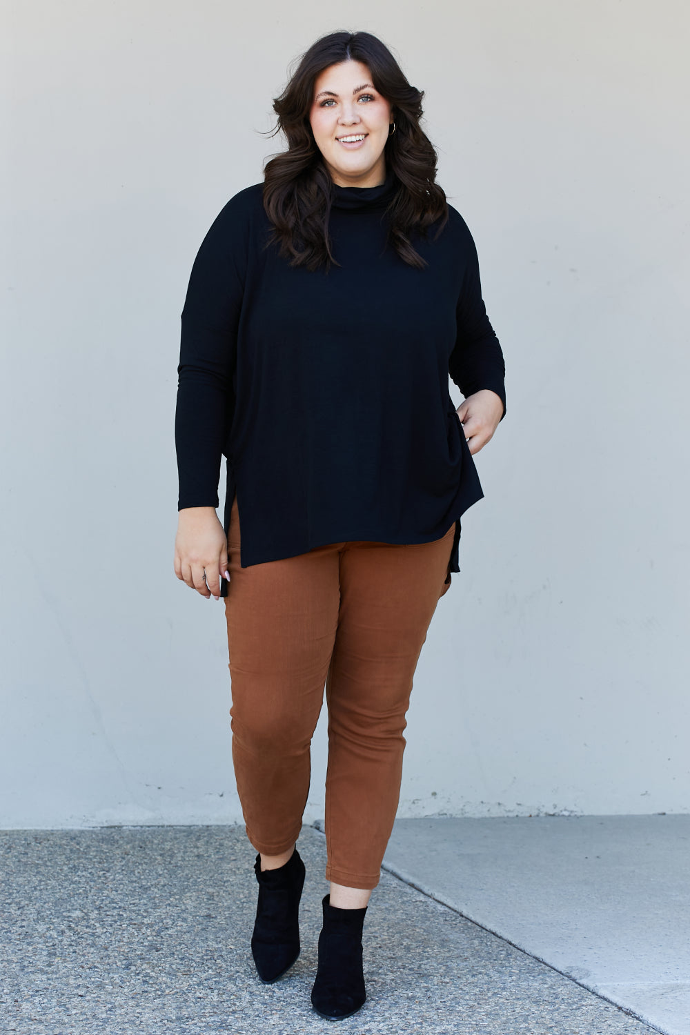 Zenana Full Size Slit High-Low Funnel Neck Top in Black, featuring a stylish slit design and cozy funnel neck, perfect for casual wear.