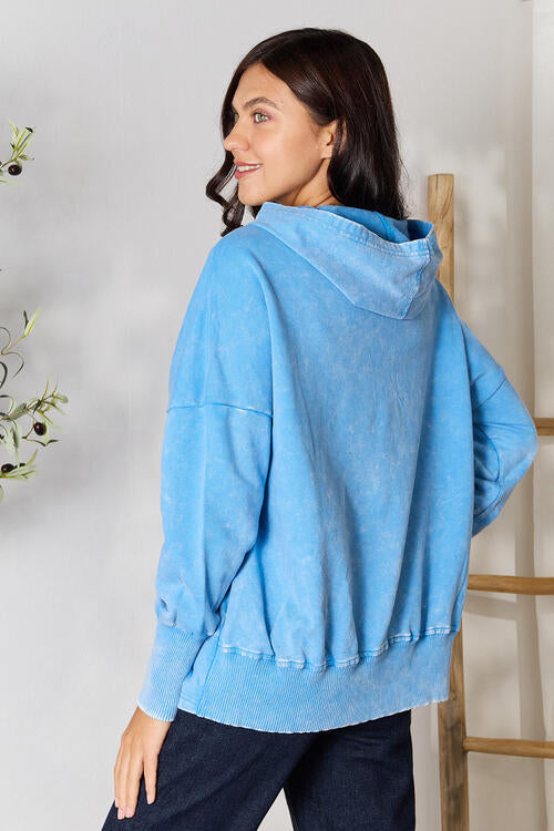 Zenana Half Snap Long Sleeve Hoodie in a stylish design with pockets, perfect for cooler weather.
