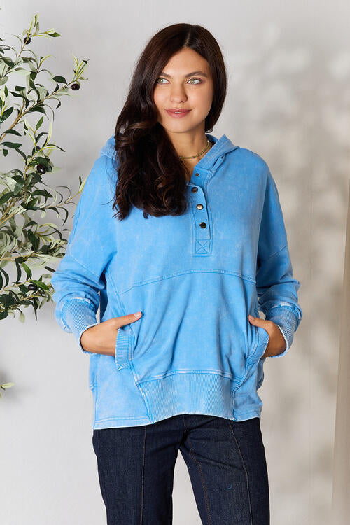 Zenana Half Snap Long Sleeve Hoodie in a stylish design with pockets, perfect for cooler weather.