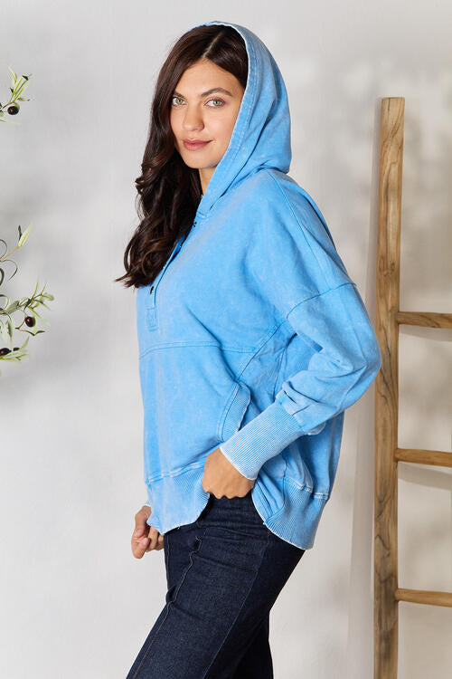 Zenana Half Snap Long Sleeve Hoodie in a stylish design with pockets, perfect for cooler weather.