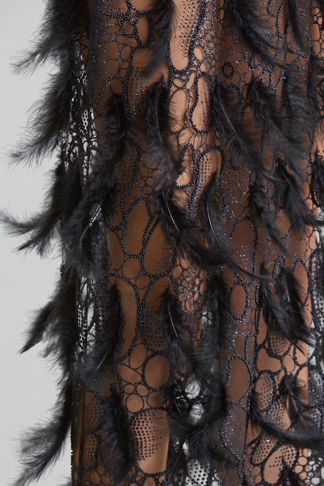 The Zoey Dress showcasing luxurious satin fabric, intricate bead detailing, and a thigh-high slit, perfect for special occasions.